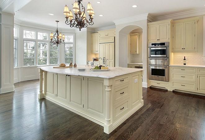 a modern kitchen with newly installed laminate floors in Erlanger, KY